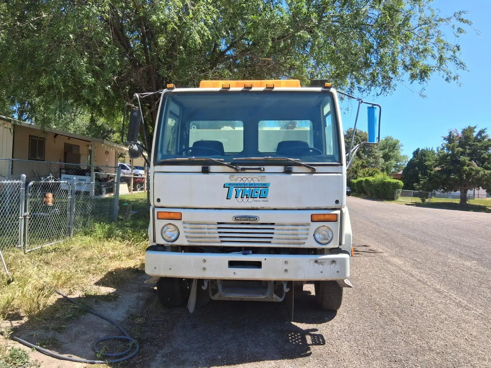 Front of a Sweep-A-Lot TYMCO sweeper truck
